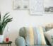 two assorted-color throw pillow on sofa beside potted plant